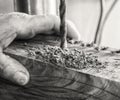 Joinery- Drill press on wood close up. Royalty Free Stock Photo