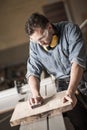 Joinery man polishing up wood