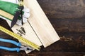 joinery tools on a dark brown wooden background, on a table in the workshop.