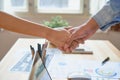 Joint Hands of Two Businessmen After Negotiating a Successful Business Agreement, And the handshake together.