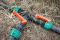 Joint of plastic pipes with faucet for water supply for farm irrigation. Gardening and pipeline industry Royalty Free Stock Photo