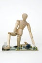 Jointed doll with computer circuit board Royalty Free Stock Photo