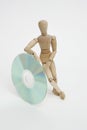 Jointed doll juggling with cd Royalty Free Stock Photo