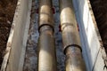 Jointed steel pipes insulated with polymer-mineral insulation in concrete slabs. Process of construction of heating