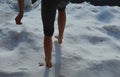 A joke where a friend throws a girl out of the house and lets her stand in the snow without shoes and locks her down. walking on s