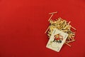 The Joker playing card lies on a pile of matches on a red background in the lower right corner. Royalty Free Stock Photo