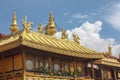 Jokhang temple gplden roof in Lhasa, Tibet with beautiful clouds Royalty Free Stock Photo