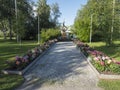 Jokkmokk, Norrbotten, Sweden, Agust 17, 2021: Flower decorations and statue at park in center of Jokkmokk, summer sunny