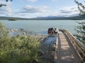 Jokkmokk, Norrbotten, Sweden, Agust 4, 2021: group of hikers with backpacks getting in motor boat transport to Aktse