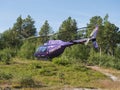 Jokkmokk, Norrbotten, Sweden, Agust 7, 2021: violet helicopter of Fiskflyg lands with supplies for Saltoluokta