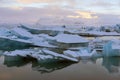 Jokulsarlon glacier lagoon and ice beach at sunrise in Iceland.