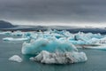 Jokulsarlon Glacier Lagoon in Iceland. Cloudy Sky, Icebergs in Water.