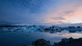 Jokulsarlon, glacier lagoon in Iceland at night with ice floating in water. Royalty Free Stock Photo