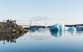 JOKULSARLON, ICELAND - AUGUST 2018: people taking pictures of iceberg in the water of Vatnajokull glacier lagoon