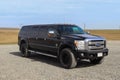 Jokulsarlon, Iceland - 23. June 2022: Front side view of a huge black Ford F350 supertruck on a parking area Royalty Free Stock Photo
