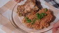Nigerian food: Jollof rice with fried chicken close-up on a plate.
