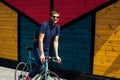 Jolly bearded man in jeans with bike02