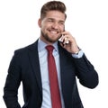 Jolly businessman laughing and talking on his phone Royalty Free Stock Photo