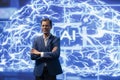 Portrait of upbeat worker working with AI machine learning algorithms