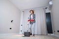 Jolly excited mature woman enjoying cleaning house, she dancing while washing floor. Happy elderly woman enjoying Royalty Free Stock Photo