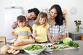 Jolly family preparing lunch together