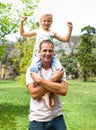 Jolly father giving his daughter piggy-back ride Royalty Free Stock Photo