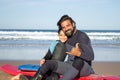 Jolly father with mechanical leg with daughter on beach