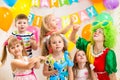 Jolly kids with clown celebrating birthday party Royalty Free Stock Photo