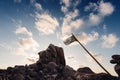 Coastal landscape of rocks with pirate flag Royalty Free Stock Photo