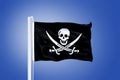 Jolly Roger Pirate flag blowing in the wind Royalty Free Stock Photo