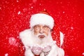 Jolly Santa Claus blowing in snow Royalty Free Stock Photo