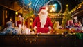 Jolly Santa Claus Works in His Studio Workshop, Wrapping and Packing Christmas Gifts for all the Royalty Free Stock Photo