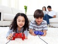 Jolly siblings playing video games Royalty Free Stock Photo