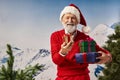 jolly white bearded Santa posing with
