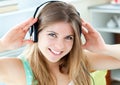 Jolly woman listening to music with headphones