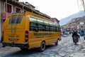 Jomsom, Nepal - November 19, 2015: Children riding a school bus to school in the early morning in Jomsom, Mustang, Nepal Royalty Free Stock Photo