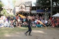 A jongleur performs a dance with burning in flames whips at the annual Bristol Renaissance Faire on September 4, 2010 in Kenosha, Royalty Free Stock Photo