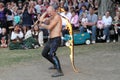 A jongleur performs a dance with burning in flames whips at the annual Bristol Renaissance Faire on September 4, 2010 in Kenosha, Royalty Free Stock Photo