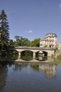 Jonzac in Charente, A serene scene of a stone bridge over the Seugne Royalty Free Stock Photo