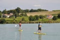 JONZAC,FRANCE-AUGUST 01, 2017: kids on a stand paddle on the pond of the leisure center of Jonzac