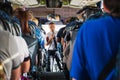 Tourists and a male tour guide with a microphone in the bus