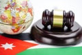 Jordan flag and Judge hammer with globe map. Law and justice court concept. Royalty Free Stock Photo