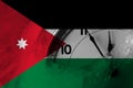Jordan, Jordanian flag with clock close to midnight in the background. Happy New Year concept