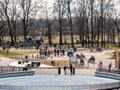 Jordan park playground in Krakow, public area during covid 19 pandemic group of people adults and children in face masks new