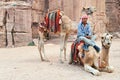Jordan. Petra archaeological site. Camels ready for tourists ride