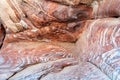 Jordan. Petra archaeological site. Colorful red rocks into cave