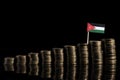 Jordanian flag with lot of coins on black