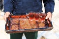 Jordanian man offering tea to the tourists visiting a local house Royalty Free Stock Photo