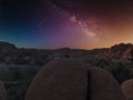 Joshua Tree National Park in California. Rocks on the dessert at night with milky way view and stars Royalty Free Stock Photo