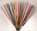 Group of colorful incense sticks on clay support Royalty Free Stock Photo